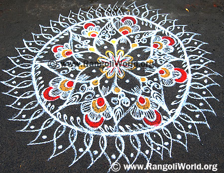 Freehand Rangoli with orange flowers and mango leaf shapes