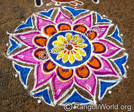 Freehand Rangoli with pink and blue flowers